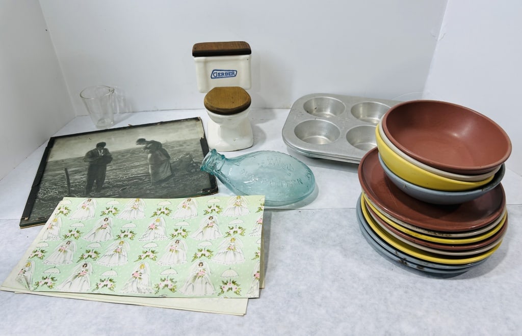 Vintage Household Items Including Desert Flower Melamine Dinnerware: This lot comprises a variety of vintage household items and novelty collectibles. Included is a set of melamine dinnerware in assorted colors featuring bowls and plates, with the base of the terracott