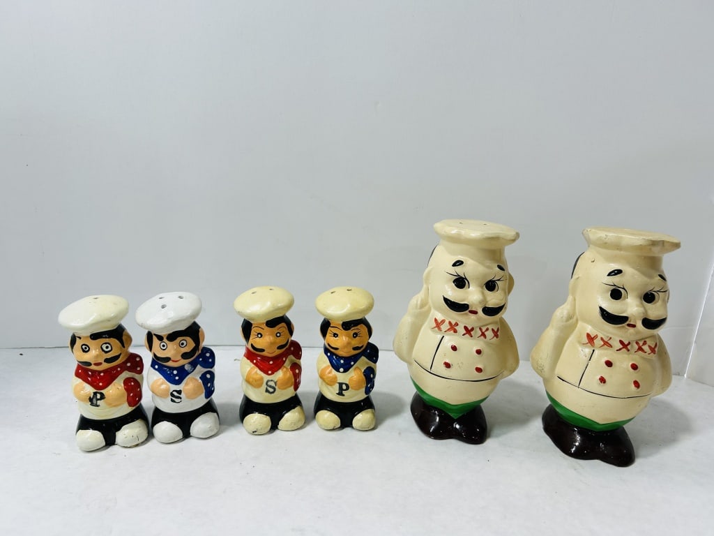 Vintage Ceramic Italian Style Chef Salt and Pepper Shakers: An assortment of vintage ceramic salt and pepper shakers in the style of mid-century Italian chefs. This collection features multiple pairs of figures with hand-painted details. The largest figures ar