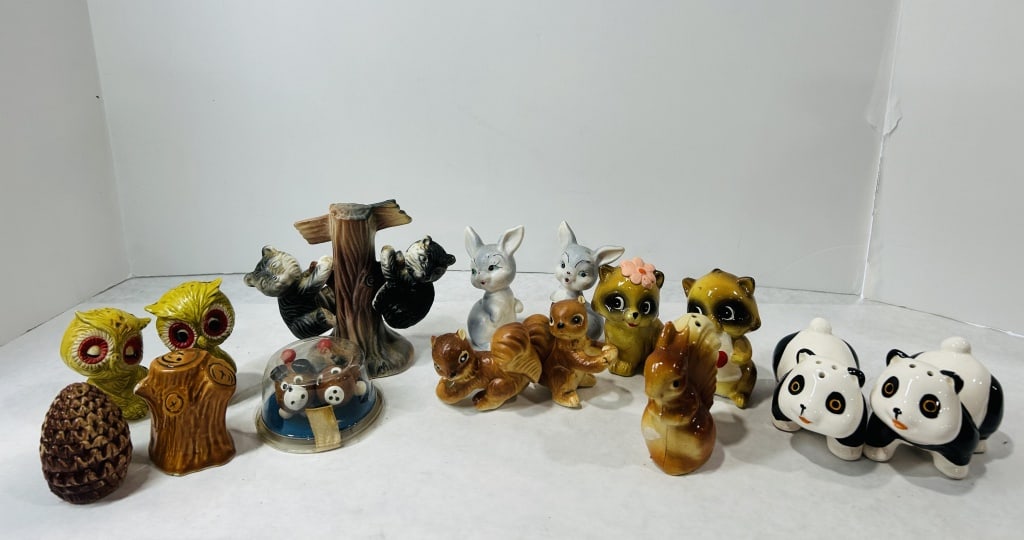 Vintage Anthropomorphic Ceramic Animal Figurines and Salt and Pepper Shakers: A collection of mid-20th-century ceramic figurines and novelty salt and pepper shakers. The group features various anthropomorphic animals including a pair of yellow owls with red-rimmed eyes, two cra