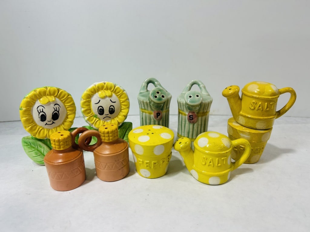 Ten Vintage Ceramic Novelty Garden-Themed Salt and Pepper Shakers: This collection consists of ten vintage glazed ceramic salt and pepper shakers featuring various garden and floral motifs. The assortment includes a pair of anthropomorphic sunflowers with expressive 