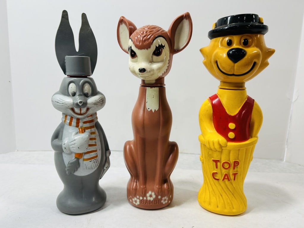 A Trio of Vintage Molded Plastic Cartoon Character Bubble Bath Bottles: A collection of three vintage blow-molded plastic bubble bath bottles depicting popular mid-20th-century cartoon characters. The group includes a gray rabbit figure styled after Bugs Bunny, wearing a 