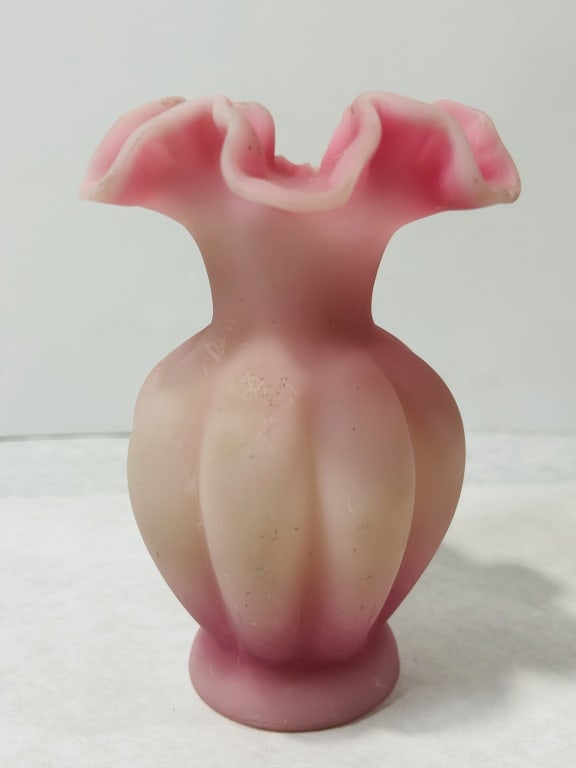 Small Burmese Satin Glass Ruffled Vase: A small art glass vase featuring a lobed melon-form body and a wide ruffled or crimped rim. The vessel is crafted from Burmese-style glass, displaying a characteristic heat-sensitive color transition 