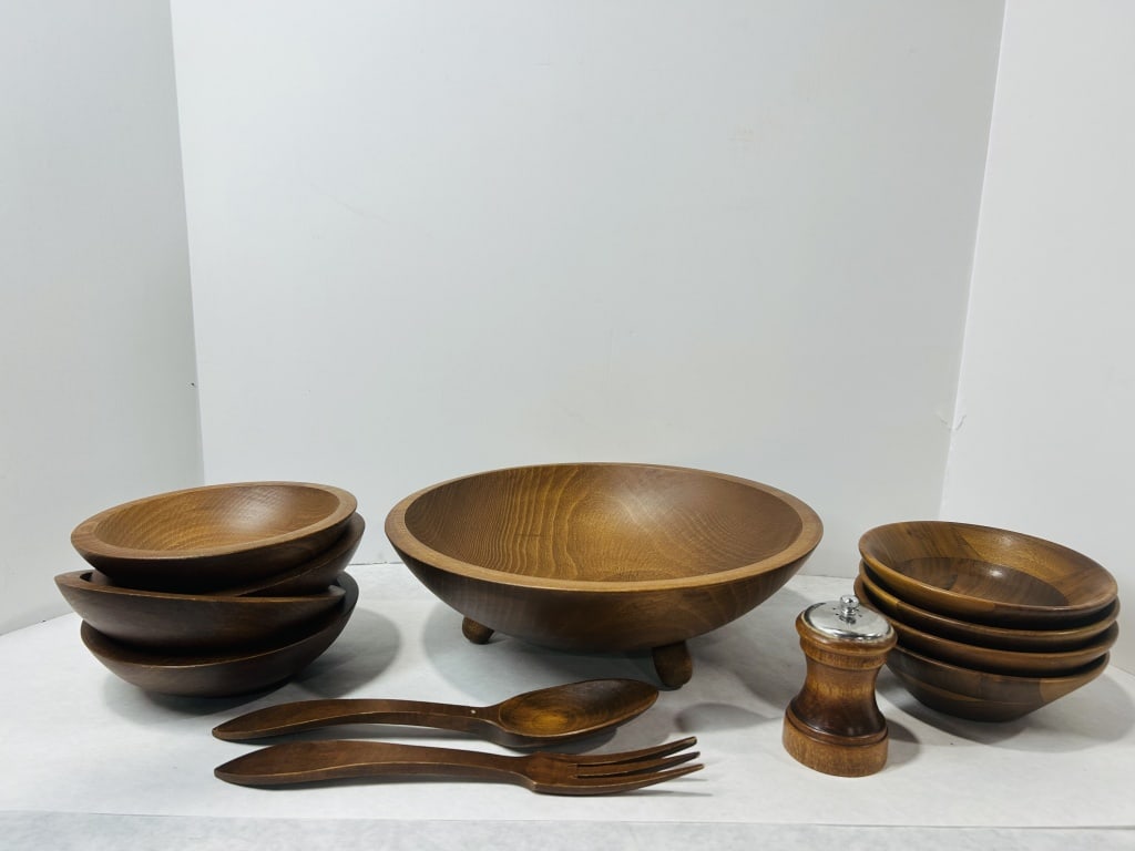 A Twelve-Piece Mid-Century Modern Wooden Salad Service Set Attributed to Woodcroftery: A twelve-piece mid-century modern wooden salad service set attributed to Woodcroftery. The collection is constructed from turned wood with a medium-brown stain and visible natural grain. The set inclu