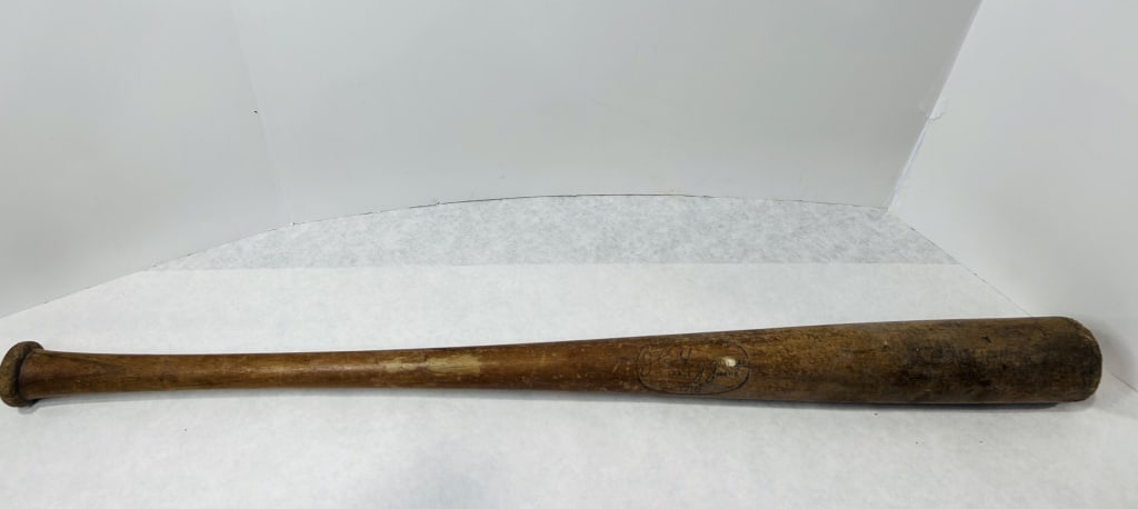 A J.C. Higgins Ralph Kiner Model 1718 Wooden Baseball Bat: This wooden baseball bat features a center brand mark within an oval border containing the text SELECT QUALITY above a cursive J.C. Higgins signature, followed by the words TRADE MARK and the number 1