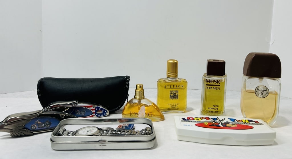 An Assortment of Vintage Men's Colognes, Themed Folding Knives, and Collectibles: This collection consists of an assortment of vintage men's grooming products and novelty items. The group includes four fragrance bottles: a 2 fl. oz. bottle of Stetson Cologne featuring a cowboy moti