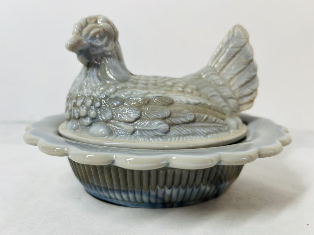 Mosser Glass Marbled Slag Glass Hen on Nest Covered Dish: A vintage covered glass dish in the classic hen on nest form, manufactured by Mosser Glass. The piece is composed of a lid molded as a nesting hen with detailed plumage and a split tail, and a matchin