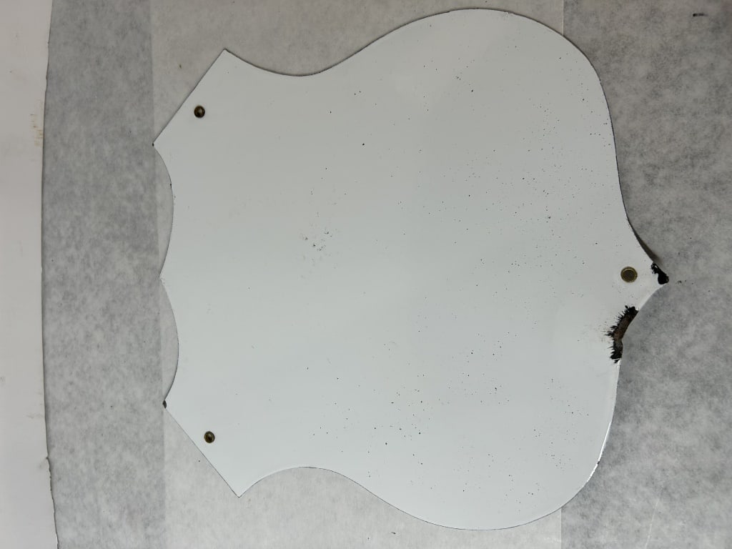 Arizona US Route 66 Die-Cut Metal Shield Sign: A shield-shaped highway route sign commemorating Arizona US Route 66. The sign is constructed of die-cut metal with a white and black finish, resembling porcelain enamel on steel. The design features 