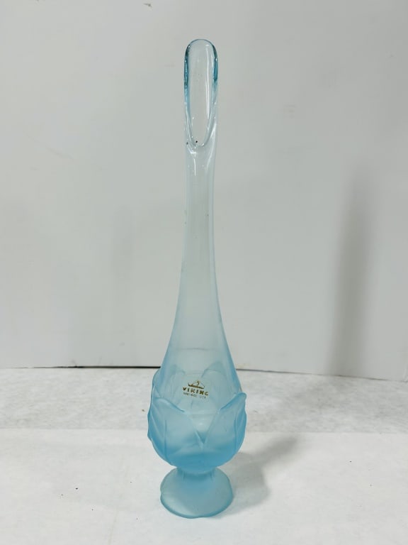 Viking Glass Satin Blue Swung Cabbage Leaf Vase: A Viking Glass Company swung vase in the Cabbage Leaf pattern. The piece is crafted from light blue glass with a frosted satin finish. The base features a molded design of stylized, overlapping cabbag