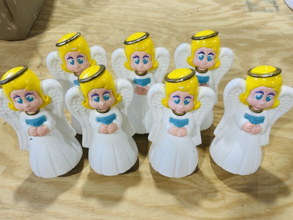Set of Seven Vintage Angel Pathway Light Toppers: This lot features a set of seven vintage angel figurines, designed as blow-mold holiday pathway light toppers. Based on visual characteristics and market consensus, these items are attributed to Gener