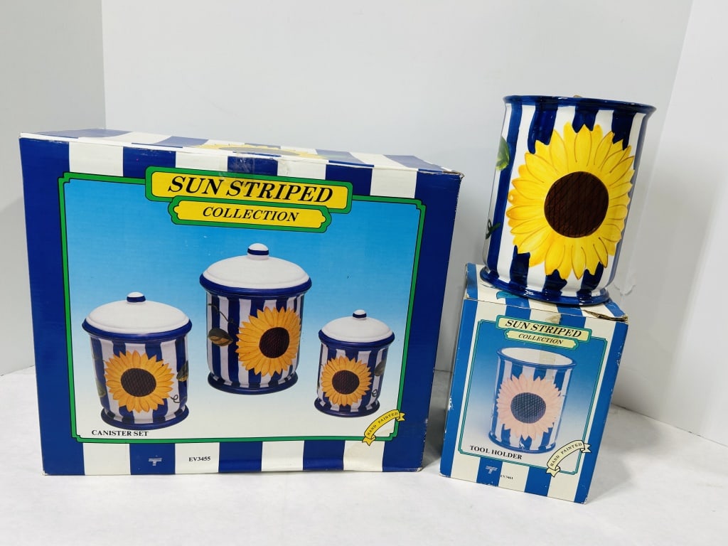 A Group of Sun Striped Collection Sunflower Motif Ceramic Kitchenware: A group of glazed ceramic earthenware from the Sun Striped Collection. The lot features a canister set and a tool holder, both decorated with hand-painted blue and white vertical stripes and a large s
