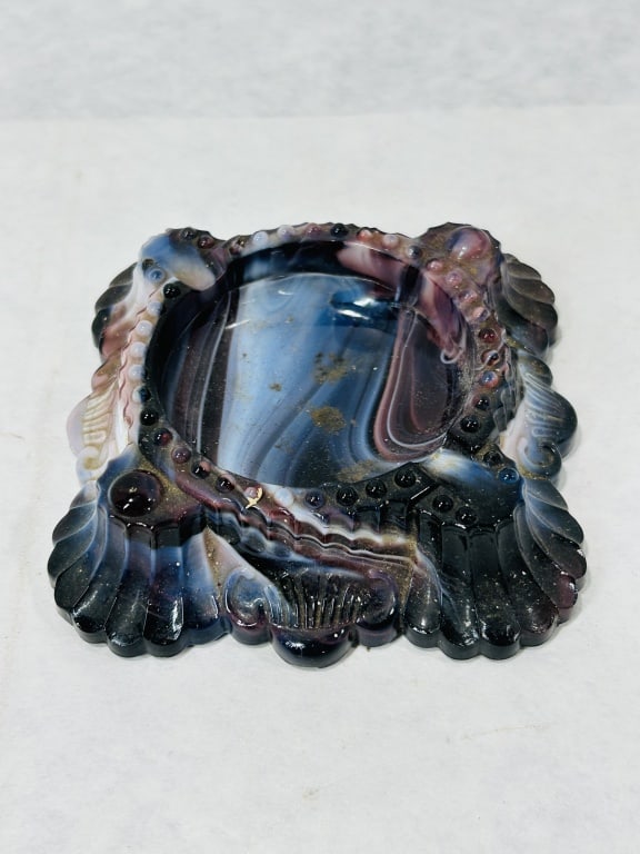 Imperial Glass Company Purple and Blue Slag Glass Ashtray: An Imperial Glass Company pressed slag glass ashtray, manufactured in Bellaire, Ohio. The piece is constructed from variegated slag glass, commonly referred to as marble glass, displaying swirling pat