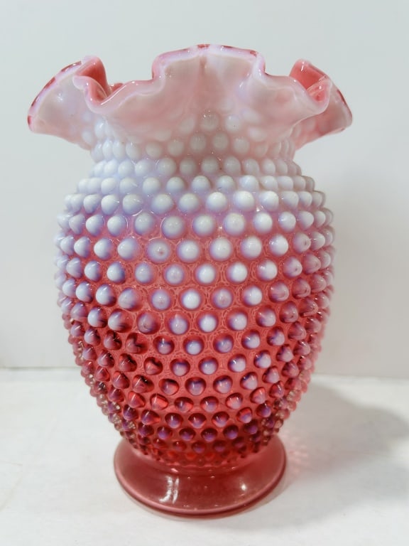 Fenton Cranberry Opalescent Hobnail Glass Vase Ruffled Rim: This decorative art glass vase is attributed to the Fenton Art Glass Company, featuring their signature cranberry opalescent hobnail pattern. The vessel is constructed of opalescent glass that transit