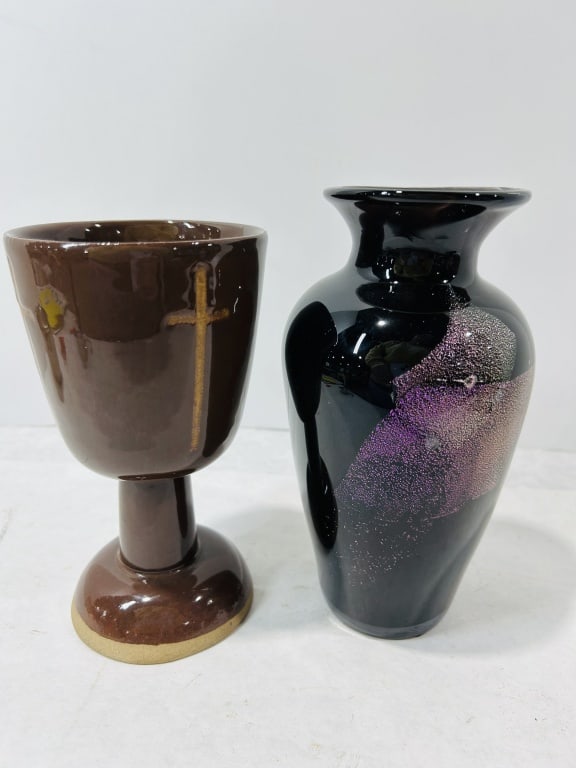 Two Decorative Items Including a Ceramic Chalice and an Art Glass Vase: This lot consists of two decorative vessels: a glazed ceramic chalice and a textured art glass vase. The ceramic chalice features a flared bowl, cylindrical stem, and a circular stepped foot. It is fi