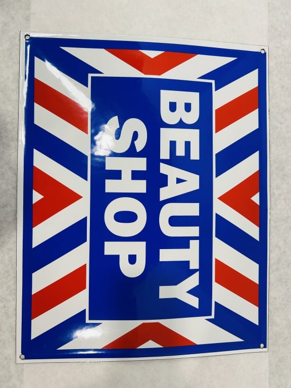 Beauty Shop Porcelain Enamel Advertising Sign: A single-sided porcelain enamel advertising sign for a beauty shop. The rectangular sign features a vertical central blue field containing the text BEAUTY SHOP in white sans-serif block lettering. Sur