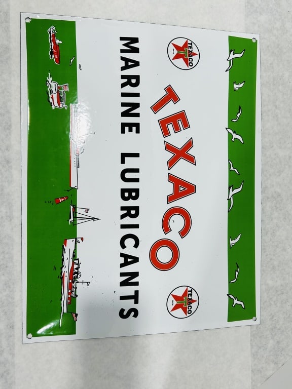 Texaco Marine Lubricants Advertising Sign: This is a single-sided advertising sign for Texaco Marine Lubricants, featuring a design consistent with mid-20th-century Texaco branding. The sign is constructed from heavy-gauge metal with a high-gl