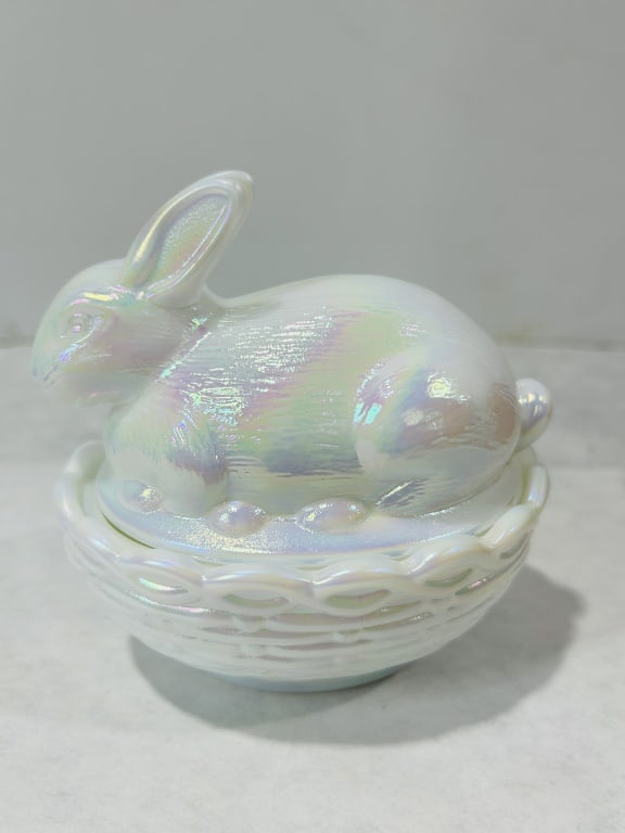 Imperial Glass Iridescent Milk Glass Rabbit on Nest Covered Dish: This two-piece covered dish, often referred to as a Rabbit on Nest, is manufactured by the Imperial Glass Corporation. The lid is molded in the form of a seated rabbit with detailed fur texture and up