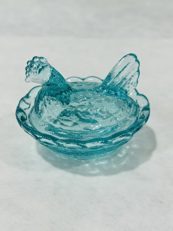 Miniature Aqua Blue Stippled Glass Hen on Nest Salt Cellar: This two-piece miniature pressed glass covered dish is a novelty item in the traditional Hen on Nest pattern, frequently utilized as a salt cellar or salt dip. The set features a lid in the shape of a