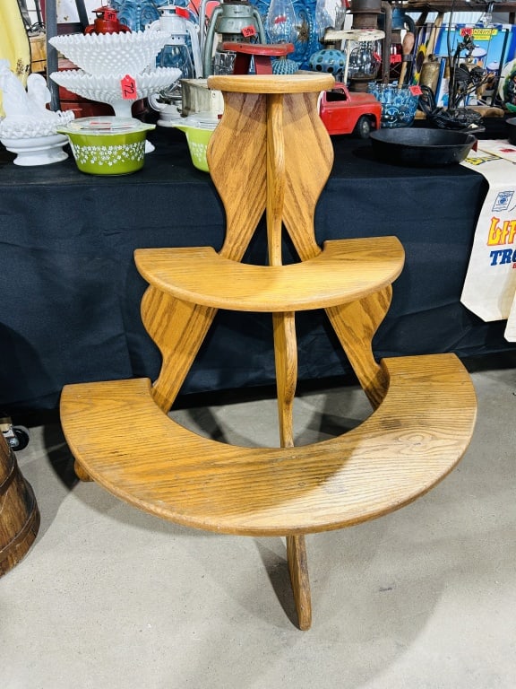 Three-Tiered Oak Half-Moon Display Stand: A late 20th-century tiered display stand, frequently used as a crock or plant stand. The piece is constructed from solid oak and oak veneers with a golden finish, showing the prominent grain patterns 
