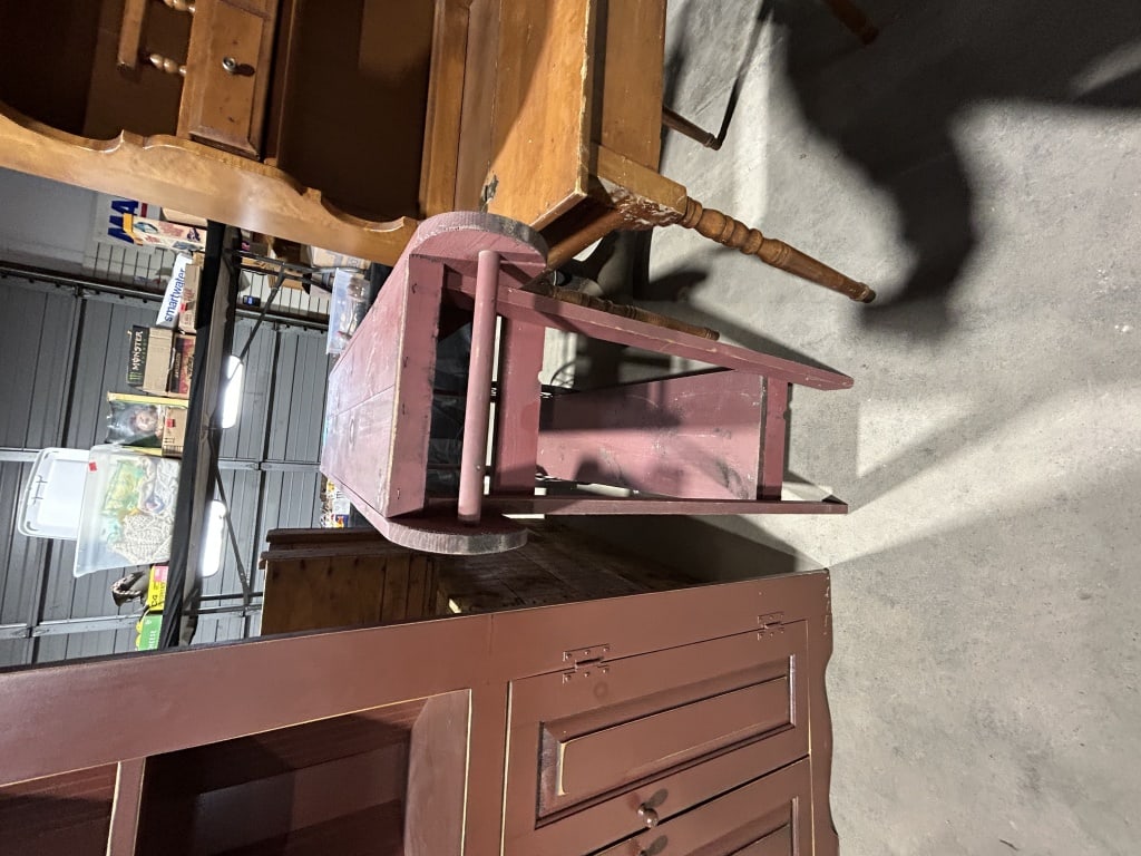 Primitive Country Style Red Painted Wooden Display Cart: This primitive country style display cart or console table is constructed of solid wood, appearing to be pine, and finished in a distressed red wash. The piece features a long, narrow top comprised of