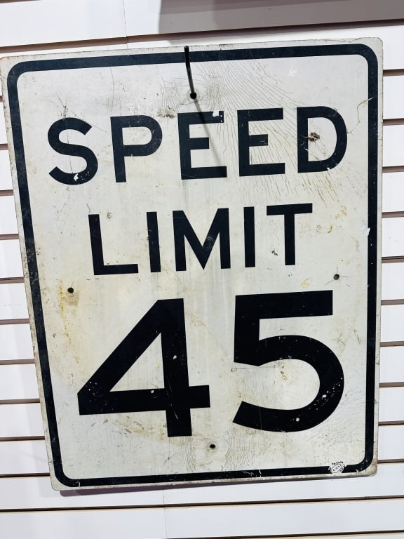 WEST VIRGINIA D.O.H. ALUMINUM SIGN, 1989: Vintage American road sign produced for the West Virginia Department of Highways featuring SPEED LIMIT 45 in black block lettering. The metal substrate is finished with 3M reflective sheeting, marked 