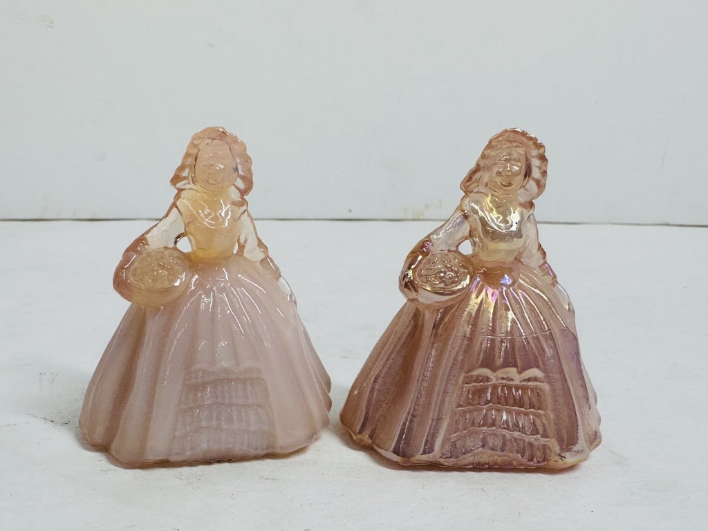 BOYD SOUTHERN BELL PINK FIGURINES, 1998: A pair of Elizabeth pattern figurines produced by Boyd's Crystal Art Glass, featuring one pink satin and one iridized glass example. The figures exhibit the embossed Boyd trademark with a letter K dat