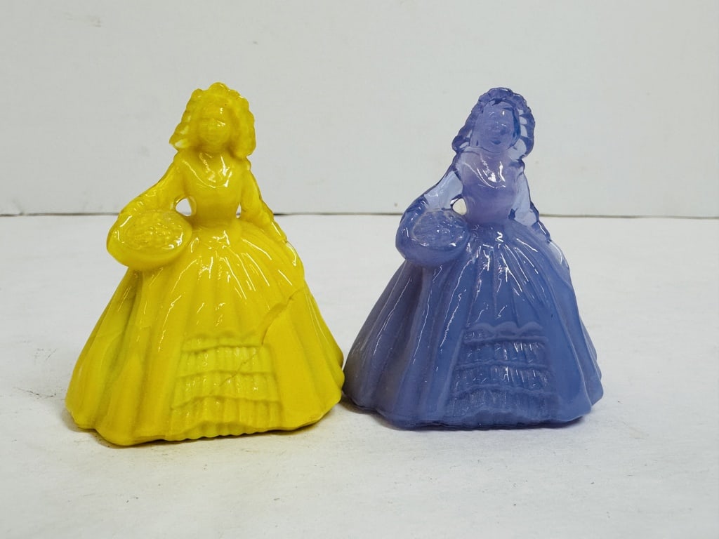 BOYD SOUTHERN BELLE FIGURINES, C. 1980: Pair of pressed slag glass figurines depicting women in mid-19th century attire. Both pieces bear the molded diamond B mark of Boyd's Crystal Art Glass on the lower reverse skirt.