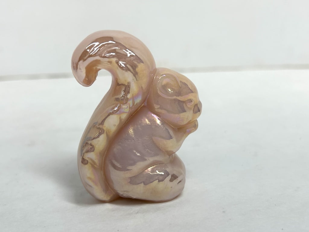 BOYD CROWN TUSCAN CARNIVAL SQUIRREL: Vintage pressed glass squirrel figurine produced by Boyd's Crystal Art Glass in Cambridge, Ohio. This piece is rendered in opaque Crown Tuscan glass with an iridescent carnival finish and features an 