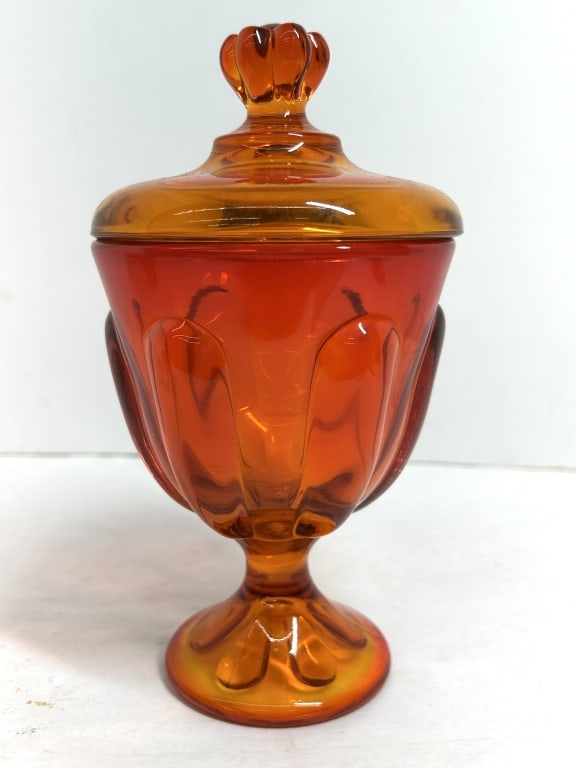 VIKING STYLE PERSIMMON CANDY DISH, 1960: Amberina glass covered candy dish in the Persimmon pattern, attributed to Viking Glass. The vessel features an orange-to-red gradient finish with molded vertical facets, a six-petal footed base, and