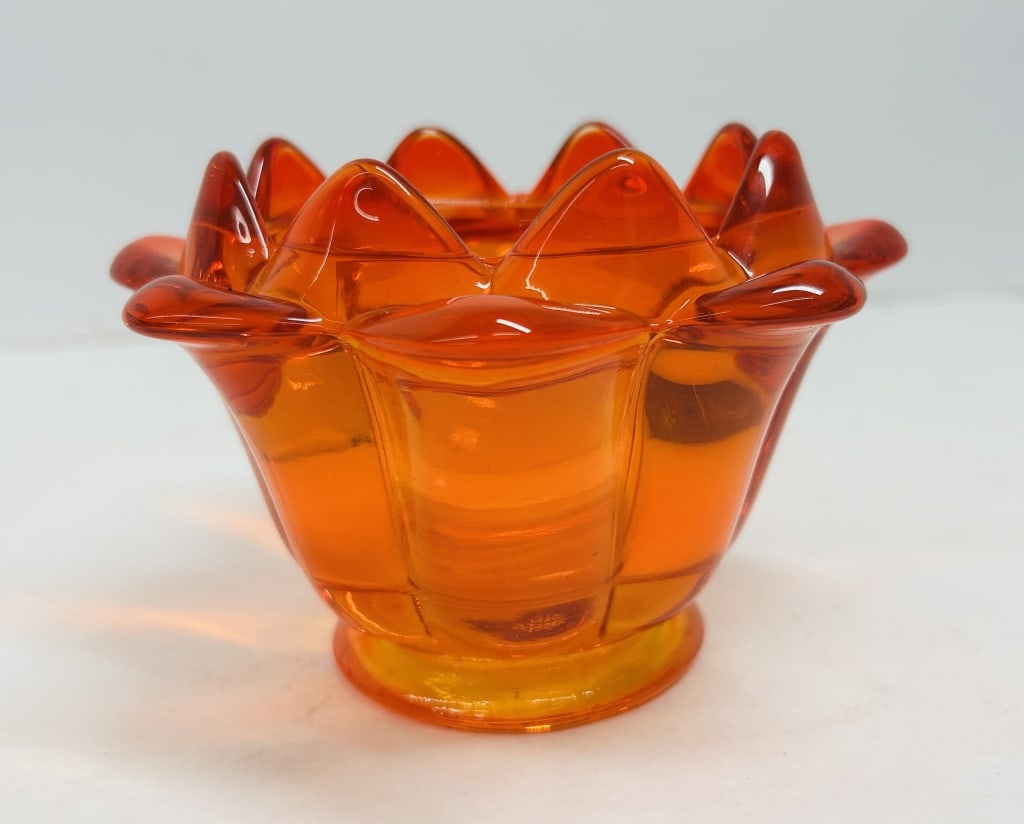 VIKING AMBERINA GLASS BOWL, C. 1960: Footed glass bowl in the Lotus pattern, attributed to Viking Glass Company. This piece features a vibrant Amberina color gradient, transitioning from deep red to bright orange.