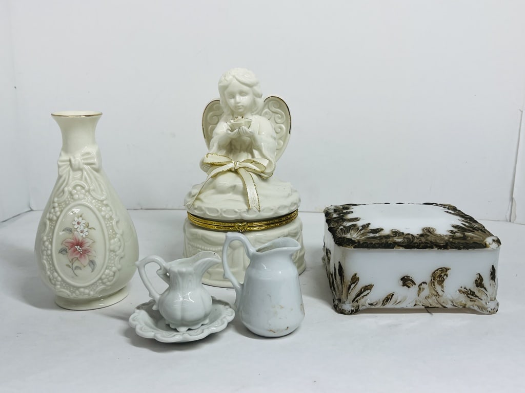 COLLECTION OF VINTAGE CERAMICS AND GLASS: A collection of white porcelain and milk glass decorative objects including a floral bud vase and a hinged angel-topped box. One item is attributed to SEI based on market consensus for this cherub des