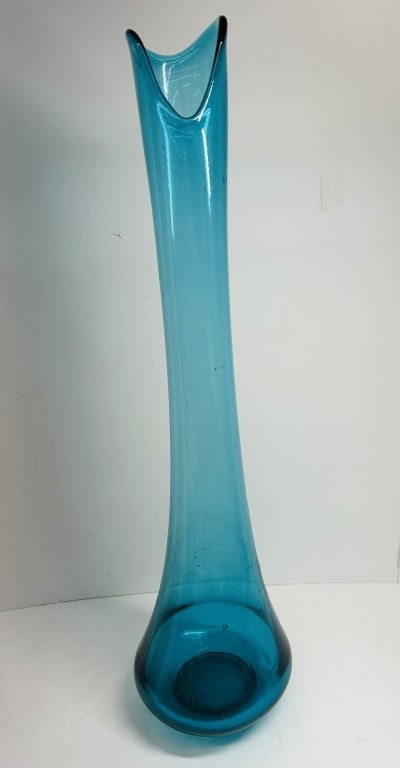 TURQUOISE SWUNG VASE, CIRCA 1960: L.E. Smith turquoise glass vase. Hand-blown vessel from the Simplicity collection featuring a three-point pulled rim and a weighted circular base.