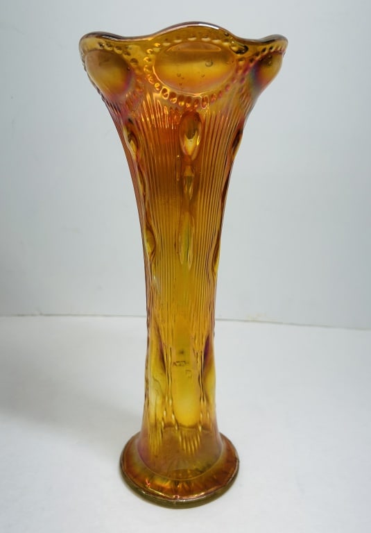 IMPERIAL BEADED BULLSEYE MARIGOLD VASE, 1910: Imperial Glass Company pressed carnival glass vase in the Beaded Bullseye pattern with a marigold iridescence. The flared trumpet form features a six-point ruffled rim and a molded twenty-four point r