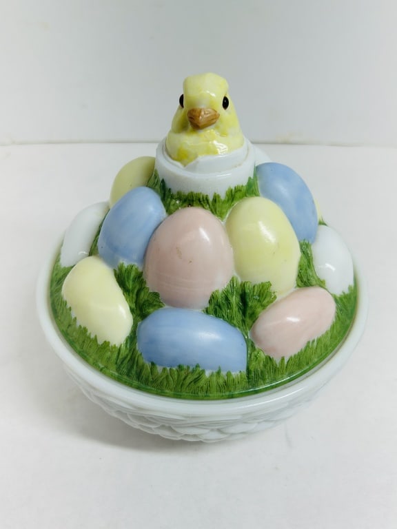 WESTMORELAND EASTER MILK GLASS BASKET, 1960S: Two-piece figural covered dish in opaque white milk glass with polychrome cold-painted decoration. The lid features a hatching chick atop multicolored eggs resting on a basketweave base with an indist