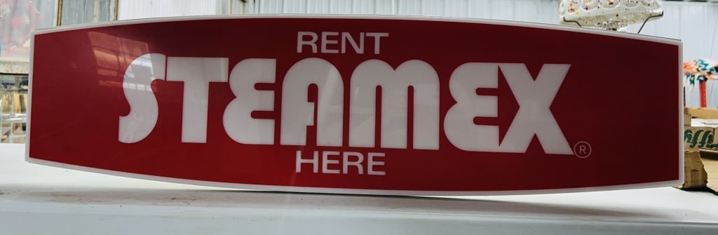 STEAMEX PLASTIC ILLUMINATED ADVERTISING SIGN, 1976: A vintage molded plastic illuminated point-of-purchase sign for Steamex carpet cleaning equipment, manufactured by U.S. Floor Systems, Inc. of Raleigh, North Carolina. The unit features a translucent 