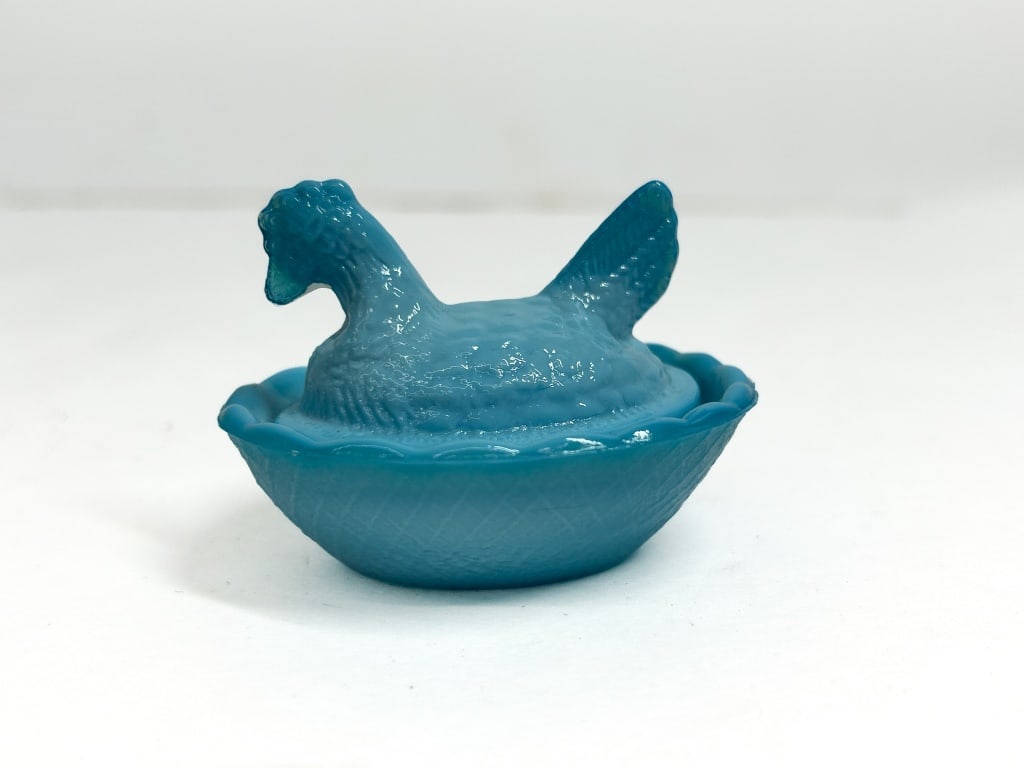 BOYD GLASS BLUE SLAG HEN ON NEST: Miniature covered hen on nest salt cellar produced by the Boyd Glass Company. The teal-blue opaque glass features a detailed nesting hen lid atop a basketweave textured base with a scalloped rim.