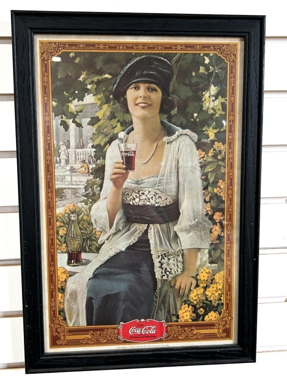COCA-COLA FRAMED PAPER PRINT, LATE 20TH CENTURY: Authorized Coca-Cola Company reproduction print of original 1921 calendar artwork. The piece depicts a woman in period attire and is presented in a black wooden frame under glass.