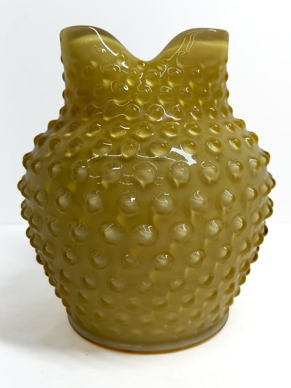 FENTON TOPAZ OPALESCENT HOBNAIL VASE, 1959: Fenton Art Glass Company bulbous vase in the hobnail pattern, featuring a topaz opalescent glass body. The vessel is finished with a four-way crimped rim and shows no maker marks, consistent with mid-