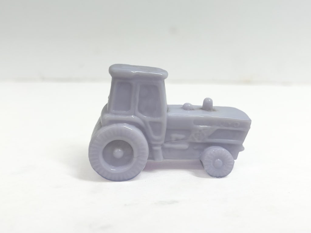BOYD ART GLASS TRACTOR 1990S: Miniature tractor produced by Boyd Art Glass. The hood features the embossed Boyd name and the B in a diamond trademark logo.