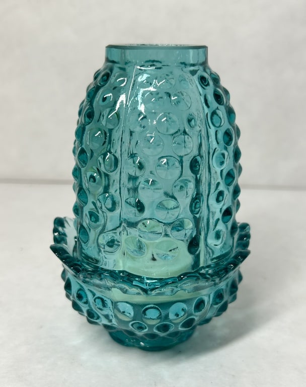 AQUAMARINE HOBNAIL URANIUM FAIRY LAMP: A two-piece aquamarine glass fairy lamp featuring a raised hobnail pattern, ruffled base, and a single previously burned white wax tealight candle. The translucent glass contains uranium and exhibits 