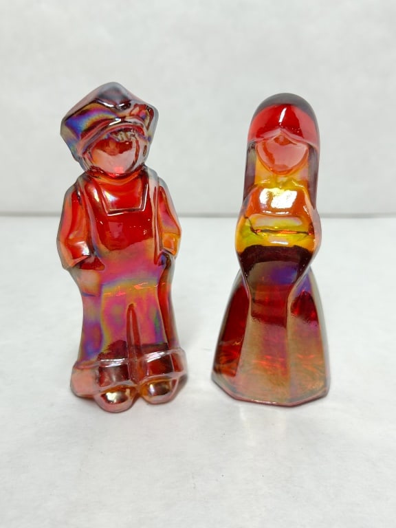 MOSSER RED IRIDESCENT GLASS JOSH JENNY FIGURINES: A pair of Josh and Jenny figurines produced in red iridescent glass with amberina tones. A monogram of the joined characters J and H is impressed on the lower rear edge of each piece (photo 4)