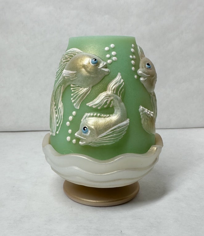 FENTON KOI GLASS FAIRY LAMP 2026 SPINDLER 1/5: A two-piece satin glass fairy lamp manufactured by Fenton Art Glass featuring relief-molded koi fish decoration. A handwritten signature in gold ink on the interior lower rim of the shade reads Fenton