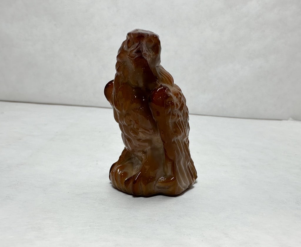 BOYD BERNIE THE EAGLE CARAMEL SLAG GLASS 1978?1983: A perched eagle figurine produced by Boyd?s Crystal Art Glass in caramel slag glass. An embossed mark consisting of a capital B within a diamond with a horizontal line through the center is present