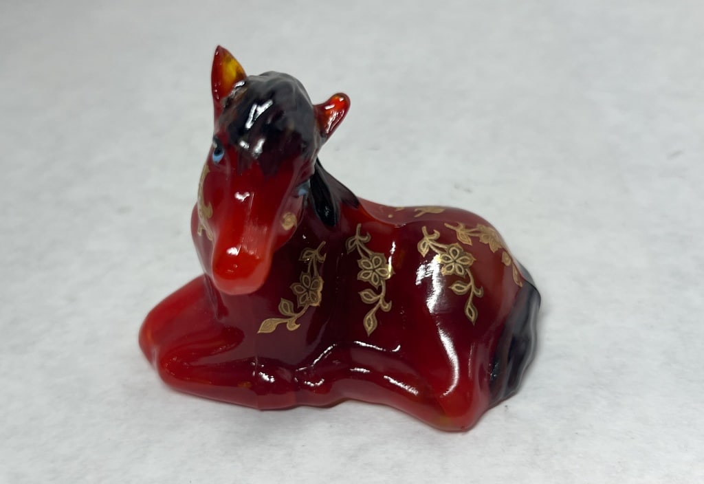 FENTON AMBERINA GLASS HORSE, SPINDLER 3/5: A Fenton Gift Shop limited edition recumbent horse figurine in amberina glass featuring hand-painted floral decoration by artist Jana Spindler. The base bears hand-written inscriptions in purple ink r