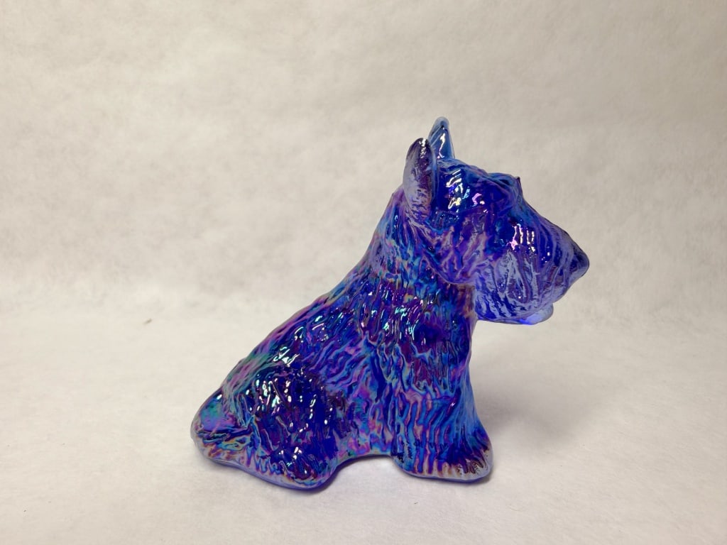 BOYD'S IRIDESCENT COBALT GLASS SCOTTIE 1988-1993: Boyd's Crystal Art Glass Duke Scottish Terrier figurine in iridescent cobalt blue glass. The piece features a heavily textured surface simulating fur and a molded mark of a capital B in a diamond with