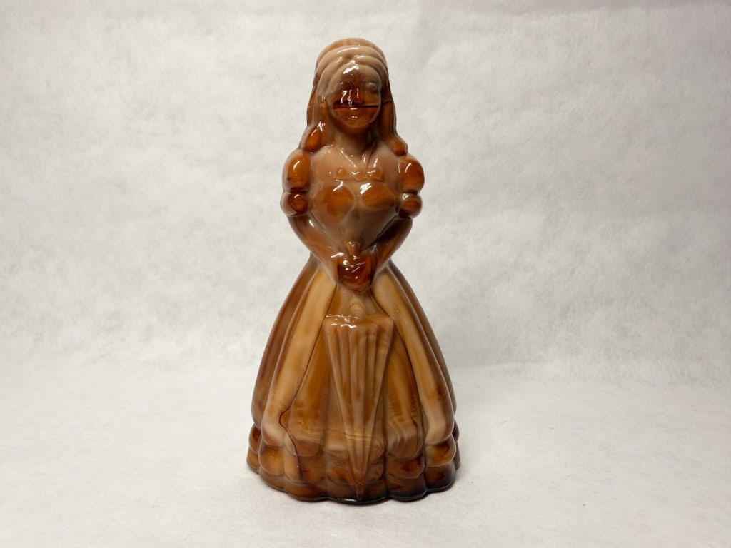 BOYD SLAG GLASS JENNIFER DOLLS, C.1980: A pair of molded slag glass figurines in the Jennifer Doll pattern produced by Boyd's Crystal Art Glass. Each example features an embossed capital letter B within a diamond-shaped border on the rear o