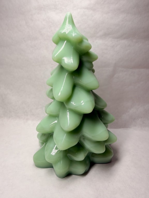 MOSSER JADEITE GLASS CHRISTMAS TREE: Jadeite glass figurine modeled as a stylized evergreen tree with tiered branches. The piece exhibits an opaque mint green color with subtle marbling and a high-luster finish. No maker marks or labels 