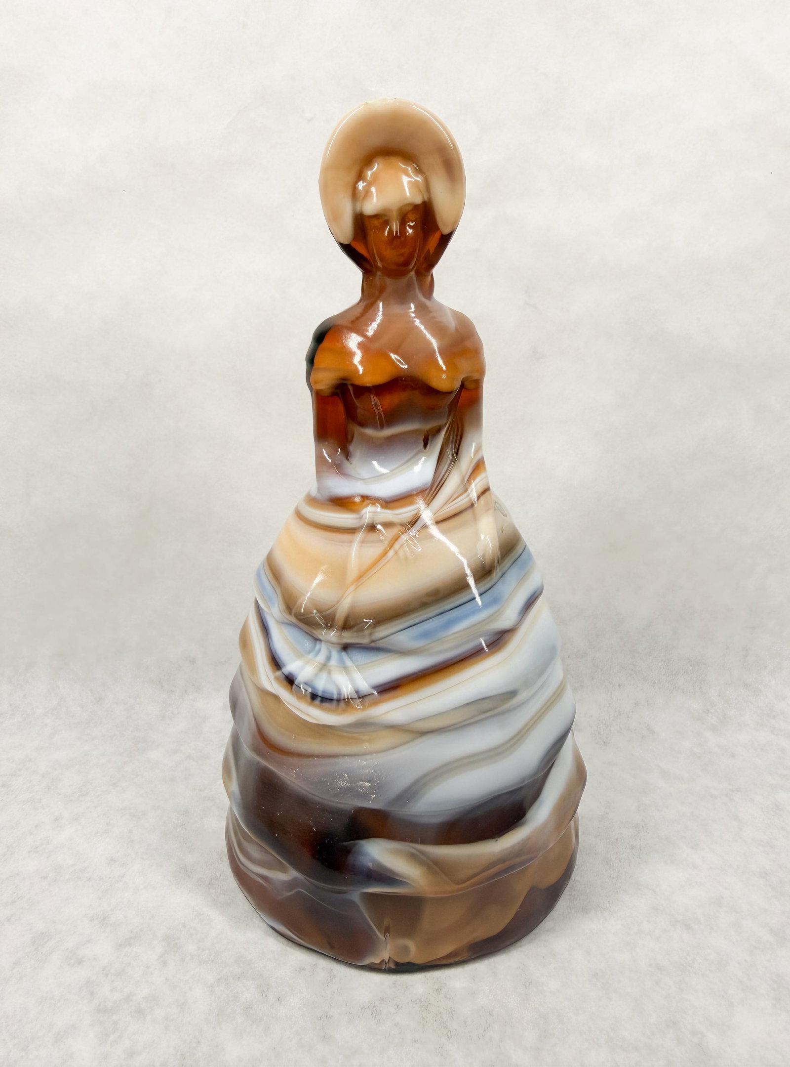 IMPERIAL CARAMEL SLAG SOUTHERN BELL: The piece features marbleized tones of amber, cream, and brown.