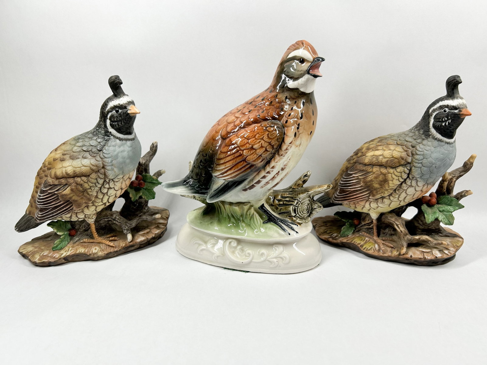 HOMCO AND NAPCOWARE PORCELAIN QUAILS, 1981: Three hand-painted porcelain quail figurines produced by Homco and Napcoware. The California quail pair bears printed black marks for Masterpiece by Homco dated 1981, and the Japanese Bobwhite quail r