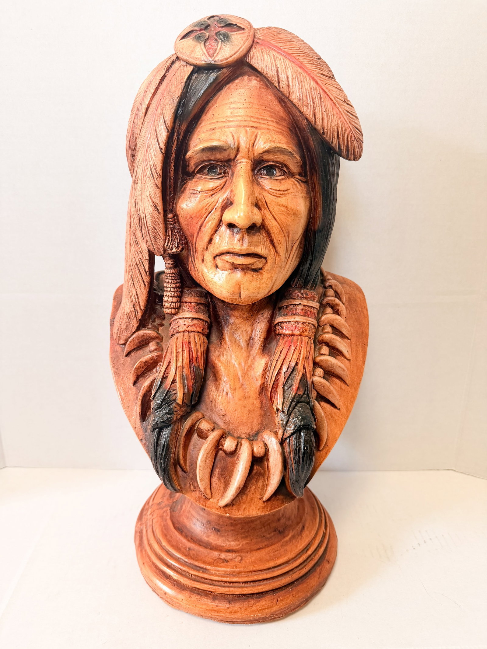 APSIT BROS CAST NATIVE AMERICAN BUST, 1981: A polychrome cast resin bust of a Native American man produced by Apsit Brothers of California. The reverse of the shoulders features an impressed mark reading APSIT BROS OF CALIF (C) 81 (photo 3).