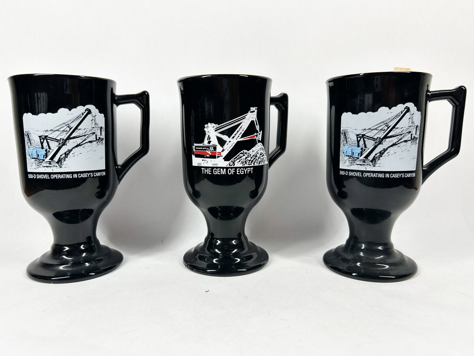 THREE BLACK GLASS MINING MUGS, 1970S (1 of 4)